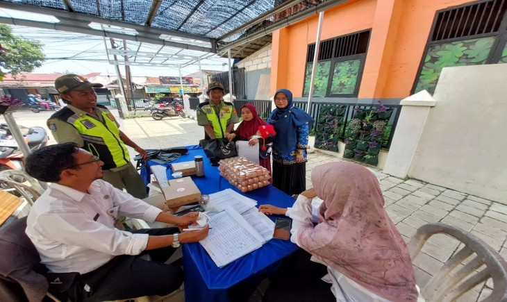 Pemkot Depok sedang melakukan pemberian bantuan pangan sumber protein kepada ibu hamil (egi/Pangannews.id)